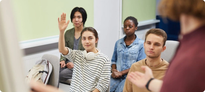 student raise hand in the classroom